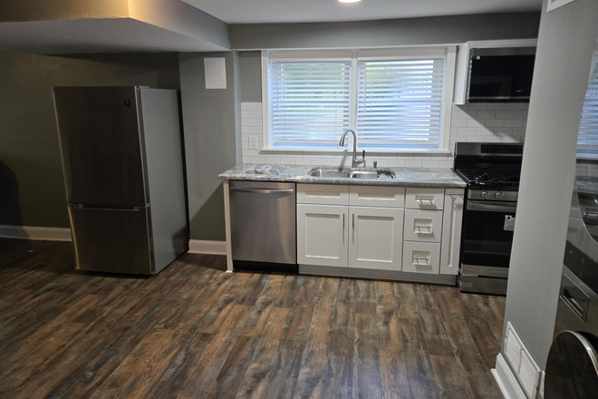Kitchen sunlight plus fridge - One Bedroom Basement Apartment with New Kitchen Minutes from Campus (utilities included)