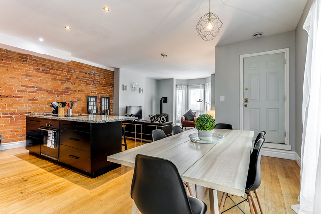 Exposed brick in Large Kitchen Living room - Fully Furnished 3 Bedroom In Family Friendly Little Italy Walking Distance to UofT Triplex