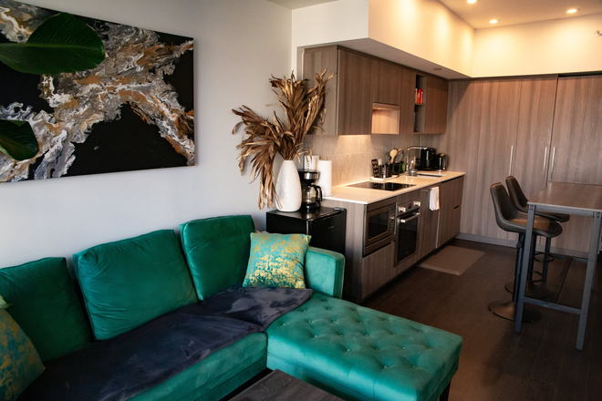 Living room and kitchen - 1 Furnished Bedroom in Sunny 2-Bedroom Harbourfront Luxury Condo