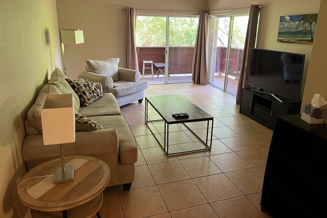 Living Room - Condo Directly Across From University-Two Bedrooms Available