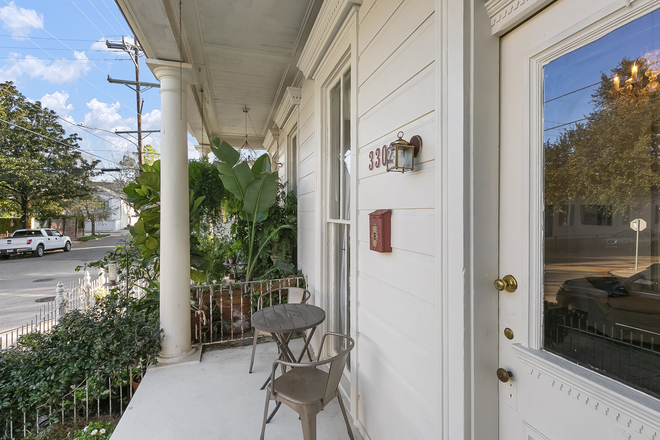 Porch seating - Furnished Garden District 2 bedroom, 1 bath apt