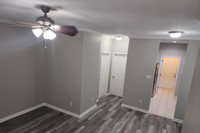 View from Living room to downstairs bedroom. - Beautiful 3 Bed 3 Bath Townhome Duplex Style For Lease