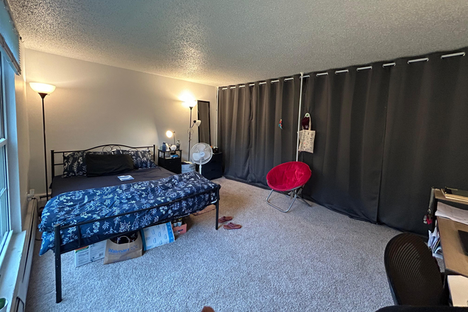 Living space-turned room - Divider curtains provide complete privacy - The Boulders Apartments