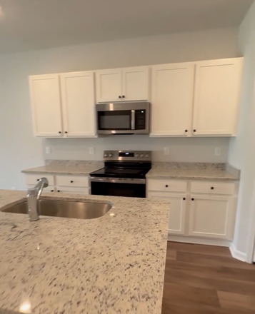 Kitchen - Beautiful new 3 bed/ 3 full baths, washer /dryer, refrigerator, garage , all new blind