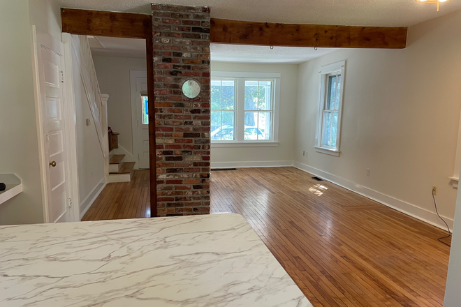 Open concept downstairs, livingroom, diningroom, kitchen space. - Available NOW! Charming 3 bedroom apartment in 5 Sister's neighborhood