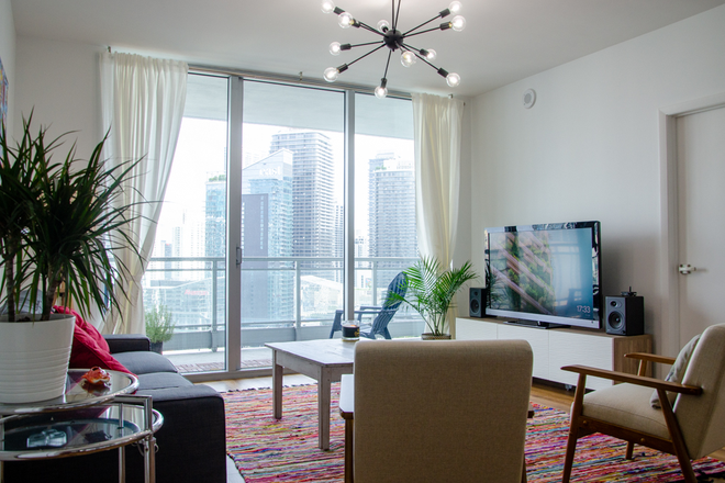 Living room - Furnished Private Bed/Bath overlooking Miami River Apartments
