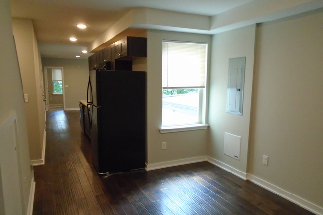 Livingroom to kitchen - Temple Villas - 1805 Bouvier St Apartments