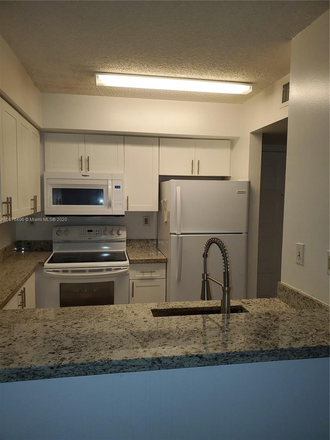 Kitchen - Walking Distance to Campus. No PARKING PASS NEEDED Condo
