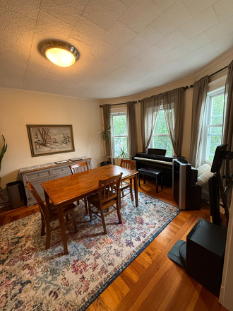 dining room - 2BR Condo Near Harvard (12 mins) – Private Laundry, Deck & Water Included