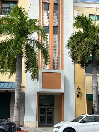 Outside street view of entrance - The Residences at Sunset Place Apartments