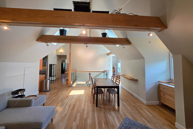Dining Living room - Modern 2 Bedroom with Cathedral Ceilings and in-unit Laundry. Harvard Sq. Condo