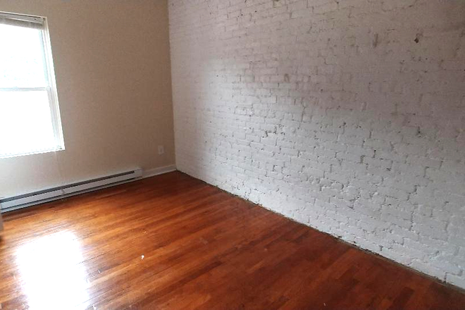 Visit hubrealtyproperties.com - Mission Hill, nice two bedroom with living room Apartments