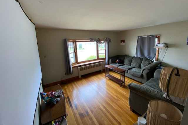 Living room from previous setup. Some furnature will remain. - Single family home, 4 bed, 1 bath, 5 min walk to north campus.