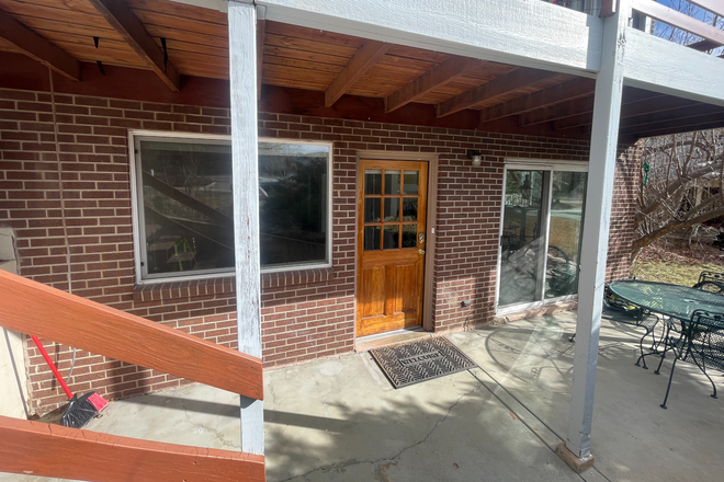 Front door and front porch. - Pre-Lease Fall 2025 - Condo with Yard near Bus Stop - 17 minute walk to Pearl St. Mall