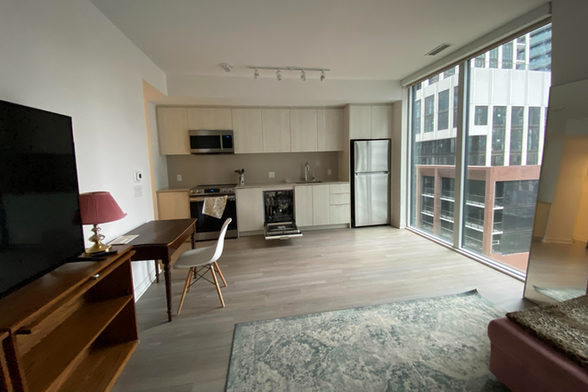 Living Room/Kitchen - Downtown Toronto Sublet – 2 Bed, 2 Bath at King & Spadina Condo