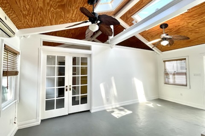Living Room. French doors to STUDY SPACE & bedrooms - Light and Bright cottage, walking distance to Chapman University. Furnished or Unfurnished Apartments