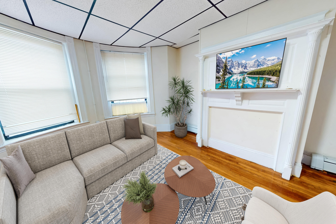Living Room - Spacious 4-bed, 1-bath in Mission Hill - NO BROKER FEE Apartments