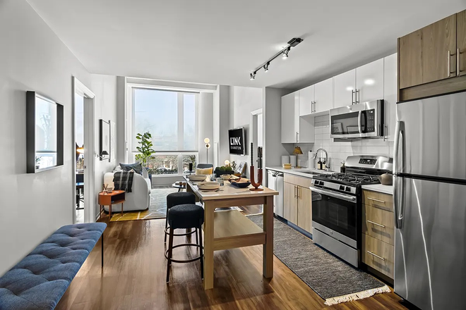 Kitchen and Living Room (from apartment website) - Fully Furnished 1 Bedroom Apartment at The Link Evanston -- Fall Sublet