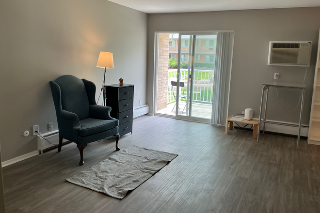 Living Room - Summer Sublease – Furnished Room with Balcony Near Downtown Ann Arbor Apartments