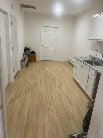 Kitchen and hallway - Easy commute to Nyu from jersey city journal square Apartments