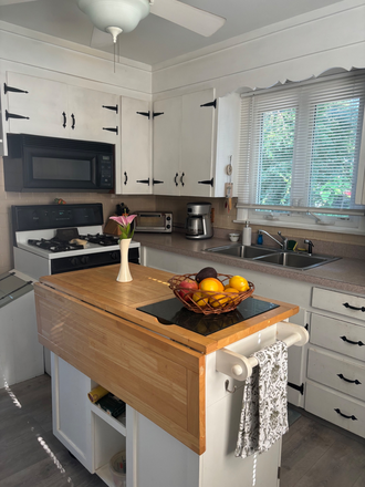 Fully stocked kitchen. - Fully furnished 2 bedroom house. $1800 plus utilities. Nearby bus stop and train.