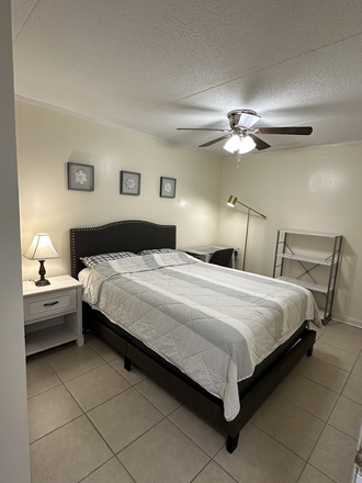 Larger bedroom with Queen bed and study area - Less than 2 miles walking distance to UT (2 bed/1 bath condo Fully Furnished)