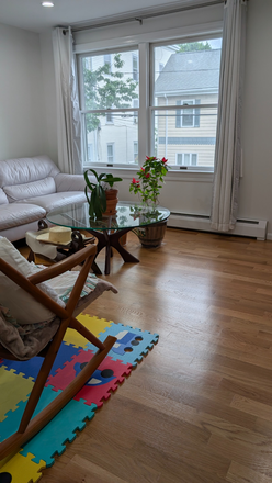 Living Room - Kendall Sq - Tri-level duplex with 2 bdr, 1.5ba with attached garage. Close to T/MIT  - No Fees! Duplex