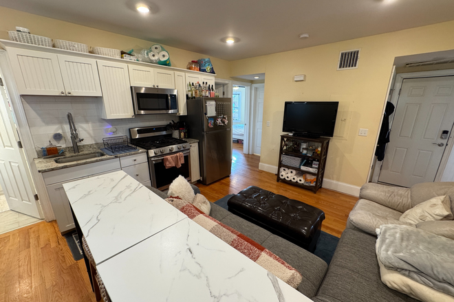 kitchen/living space - Renovated 4 Bed / 2 Bath w/ LAUNDRY IN UNIT! Low move-in costs! Available 9/1/26!! Apartments