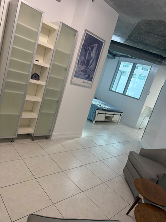 Entrance and living room area, - Updated loft apartment near train & mall