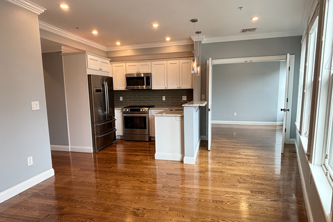 living room - Modern Forest Hills 2 bed + office with AC, deck, and in unit laundry - NO FEE! Apartments