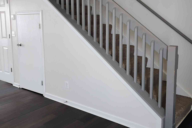 Utility closet under staircase, stairs lead to bedrooms - RedPoint Apartments