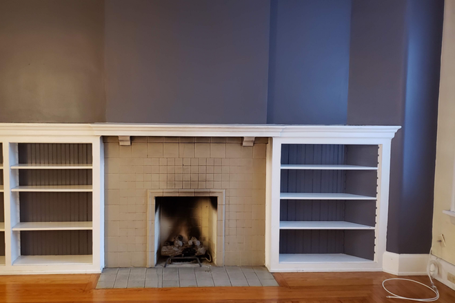 Fireplace with built in bookshelves - Available April 2025!  Walk to XU.  Large 3br with tons of space and character! Condo