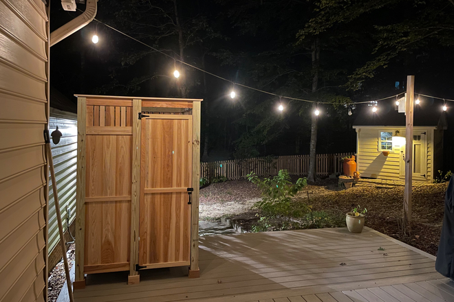 The back deck and bistro lights are a great place to hang out in the warmer months. - Quiet 2 Bed 1.5 Bath House In Walkable Neighborhood