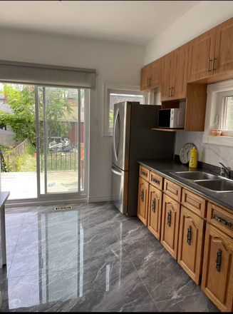 Kitchen view and entrance to backyard+porch - 1 furnished bedroom available in Little Italy all utilities included