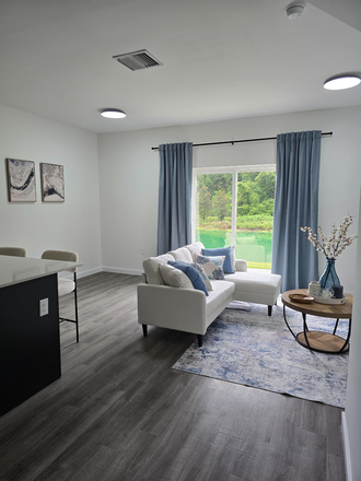 Livingroom - Eagle Trace - Brand New Condo! Only 2 miles from Campus - Bedrooms w/bathroom, walk-in closet