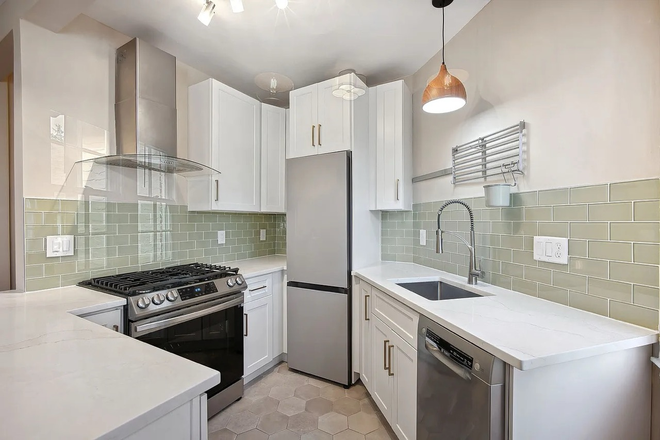New kitchen with ample cabinet and countertop space - Large Renovated Petworth 1BR | Historic Charm, Modern Updates, 780 Sq Ft Apartments