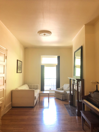 Living Room - Large Furnished Charles Village Apt. 1 BR, 1 Bath. Flexible term lease: 1 mo min. Wood floors