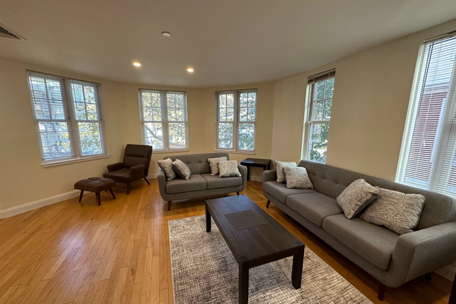 Living Room - 12 month lease: 1st floor in two-story 3BD/2BR, 15 min commute to NE, BWH; Furnished!