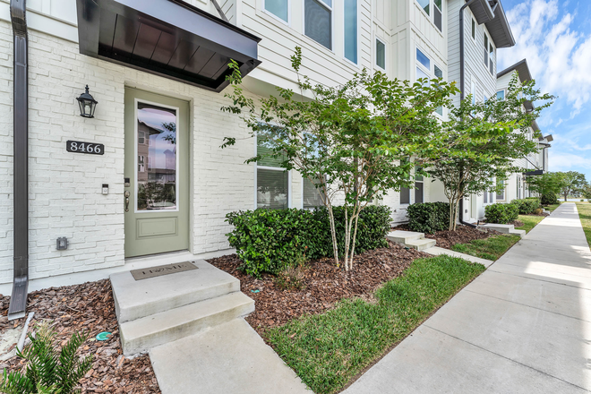 Outside Street View - FULLY FURNISHED! Stylish Townhome with High-Quality Vinyl Flooring