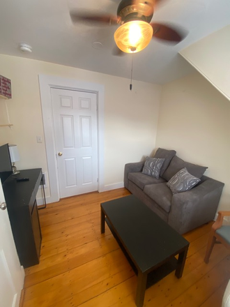 Living Area - Furnished 1-Bedroom with Office Nook & Living Room – JP Apartments