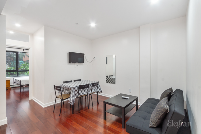 3BR Unit: Living Room - Modern, Elegant Studio, 2 BR, and 3 BR Apts in Downtown Manhattan; Walking Distance to Campus