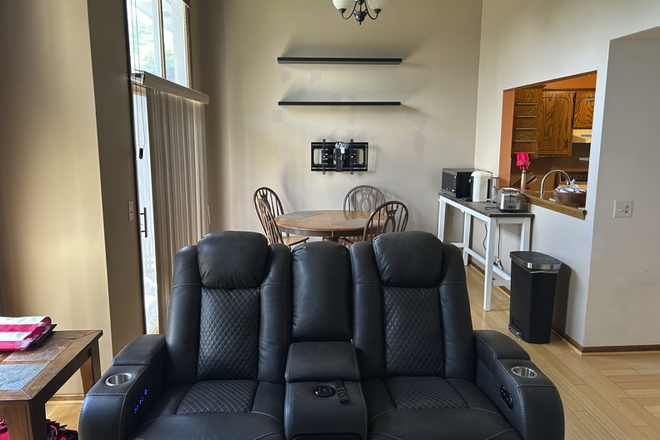 Another Angle of Shared Living Room + Dining Room - Furnished Private Lower-Level Suite for Creighton / UNO Student — Aksarben Village Condo