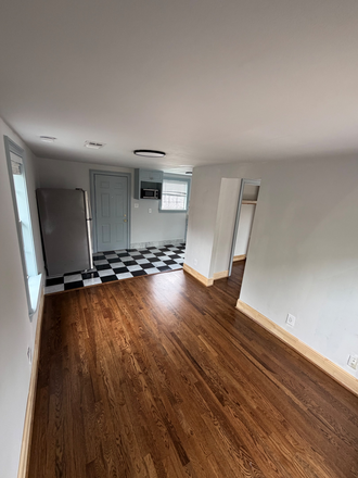 New Select Oak Hardwood Floors - Living Area with View of Kitchen - 1 Bedroom Apartment - Walkable to Rice University in Historic Boulevard Oaks
