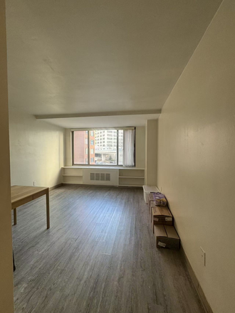 LIVING ROOM WITH WOOD FLOOR - Fully furnished apt at unfurnished price includes all utilities