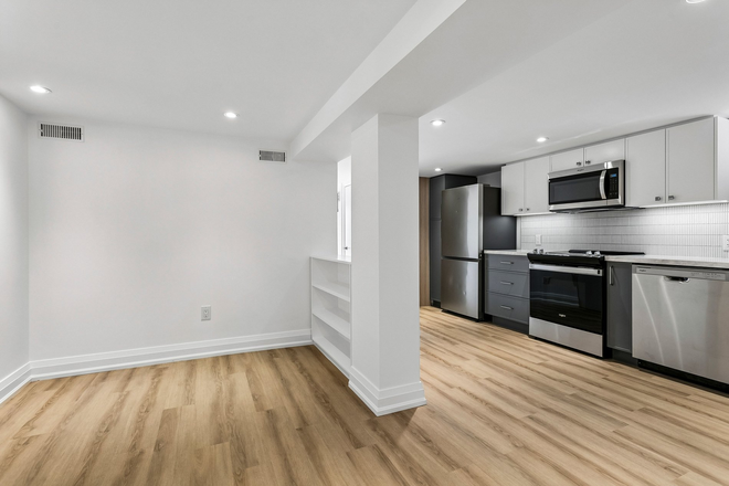 Comfortable living area adjacent to kitchen - Newly Renovated 2 Bedroom - Oakwood LRT and Cedarvale Subway Duplex