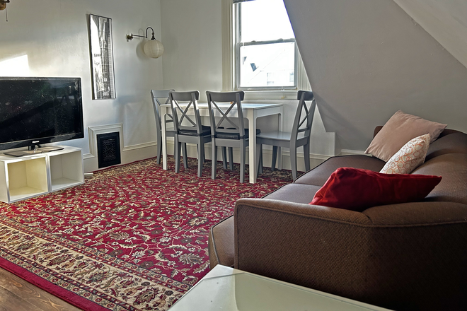 Living room - 1 bedroom fully furnished studio, utilities included Apartments