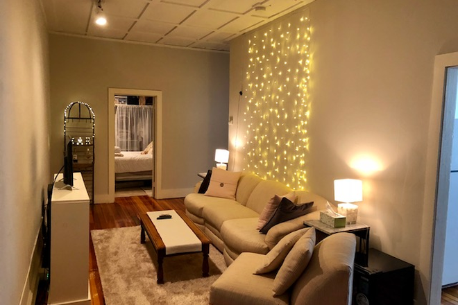 Living room in 3 bedroom - Avail. 7/1/26 High ceilings, wood floors, located in the center of town, tile bathroom Apartments