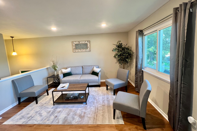 Living room - $500 of 1st Mo Rent - 5bedroom close to campus Duplex