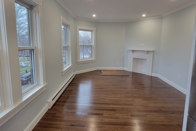 Living Room - Harvard Square Newly Renovated 1 Bed. Park Views! LL pays Fee! Apartments
