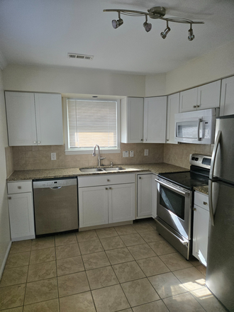 Kitchen with Stainless Steel Appliances - Quick access by foot or bike to UNC and Franklin Street. Apartments